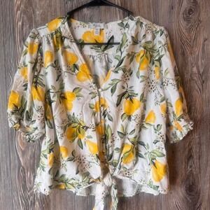 Yellow + white lemon print blouse with ruffle hem and 3/4 sleeves. Size Large